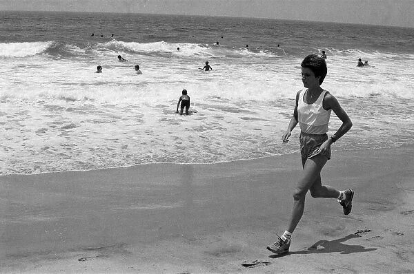 The 1984 Summer Olympics in Los Angeles. Wendy Sly running on Manhattan Beach, California