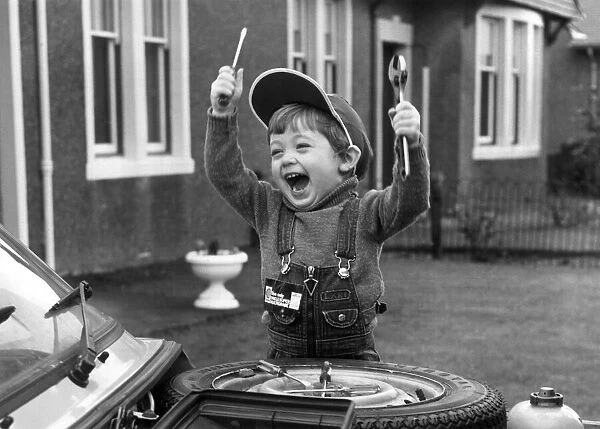 2 year old car enthusiast Stuart Douglas with his tools. 25th January 1980