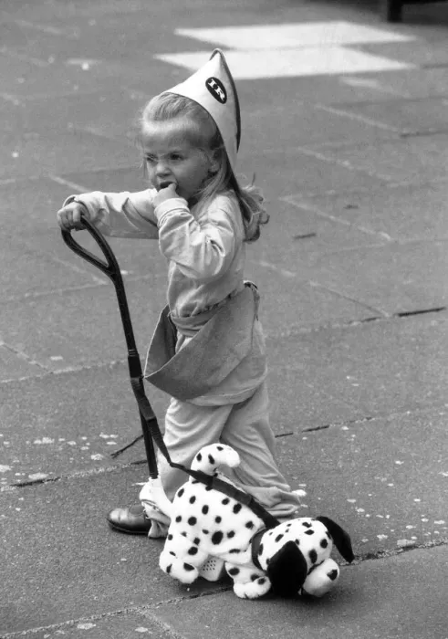 Framed Print : 2 year old Thea Behbahani tries out a new plastic trike and nodding dog Framed Print : 2 year old Thea Behbahani tries out a new plastic trike and nodding dog