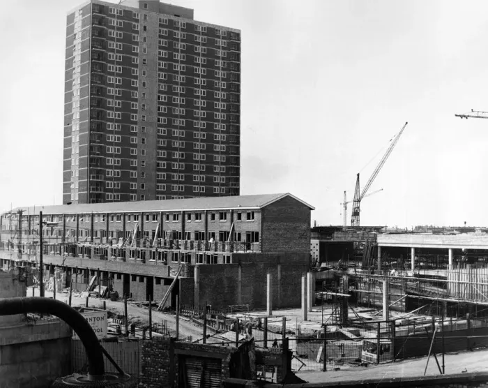 Framed Print : A 22-storey block - shops at ground level and flats above - dominates the scene of more Framed Print : A 22-storey block - shops at ground level and flats above - dominates the scene of more
