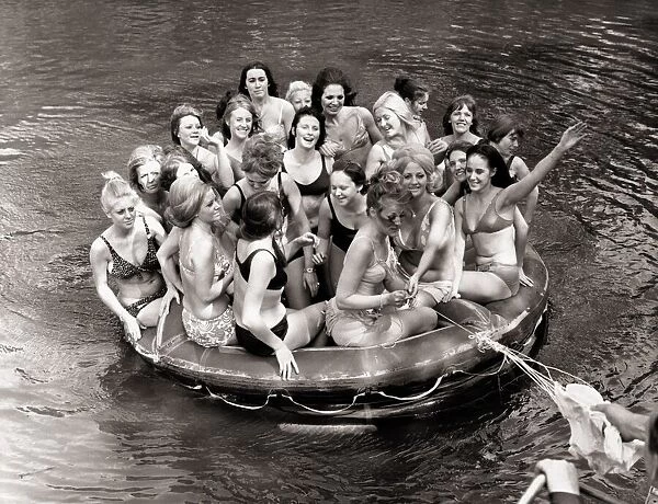 There are 25 gorgeous girls packed into that little rubber dingy
