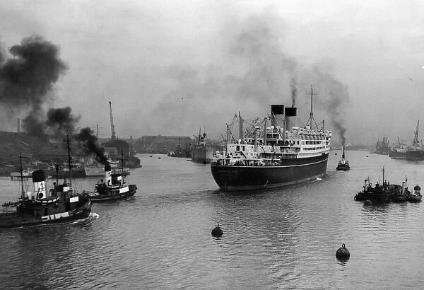The 27, 000-ton motor liner ship the Dominion Monarch entering the River Tyne