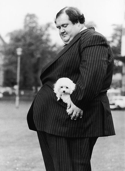 28 stone Colin Taylor and his poodle Tiny Tina in his pocket, go for a walk in Streatham