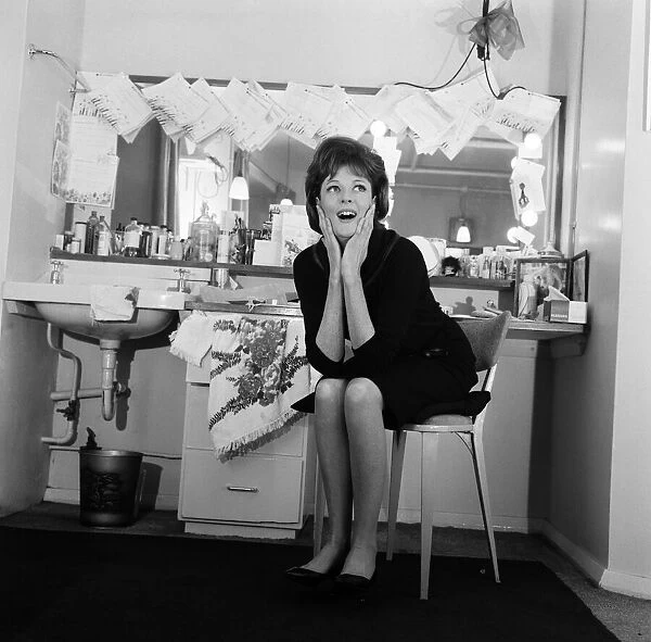 28 year old actress Maggie Smith in her dressing room, looking at the Telegrams pinned