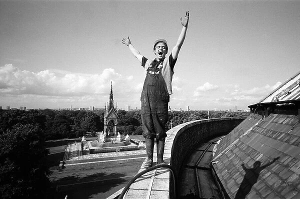 33 year old Patrick MacKenton from London, bursts into song on the parapet of the Albert