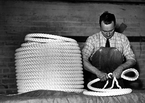 4 inch Nylon towing ropes being finished by hand. 29th April 1948