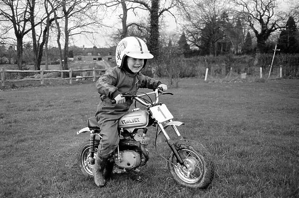 4 years old Jan Dixon on his mino motor bike. December 1974 74-7664-007