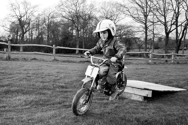 4 years old Jan Dixon on his mino motor bike. December 1974 74-7664