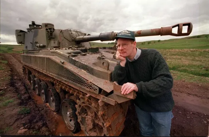 Framed Print : 4X4 off road instruction for road record instructor beside battle tank circa 1990s
