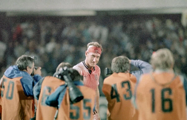 6 September 1989, Sweden v England. Terry Butcher being photograped by members of
