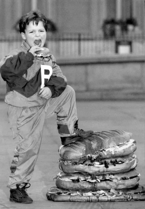 Framed Print : 6 year old Billy Sicklemore enjoying the biggest ever B. L. F sandwich in Trafalgar Square Framed Print : 6 year old Billy Sicklemore enjoying the biggest ever B. L. F sandwich in Trafalgar Square