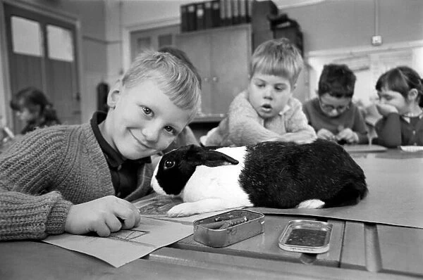 6-year-old John Sweeting (fair-haired boy with his pet rabbit in the classroom at