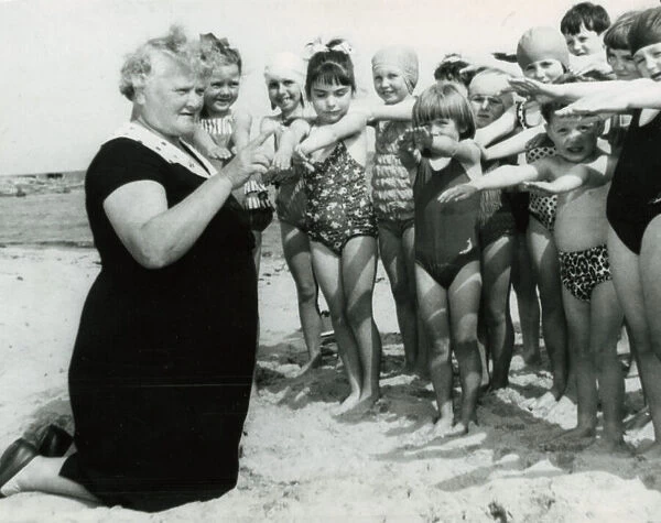 66 yr old Jessie MacKay August 1966 teaching swimming lessons to local children