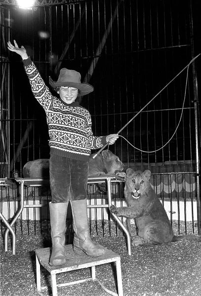 7 years old Paul Colins, seen here in the circus ring lion taming. January 1975 75-00028