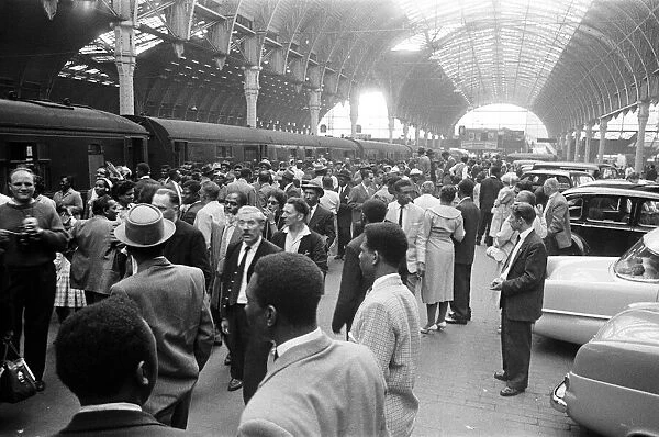 700 West Indian immigrants arrive at Paddington Station, London