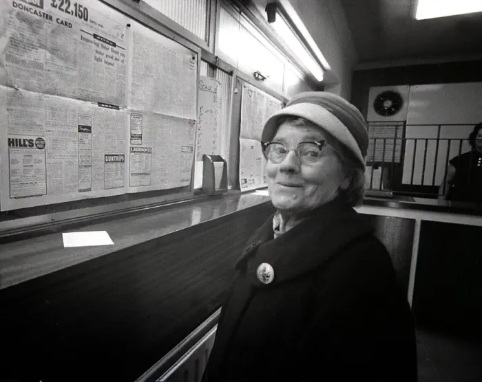 Framed Print : 72 year old lady Lottie Benger pops in to a Ladies only betting shop in Worcester to