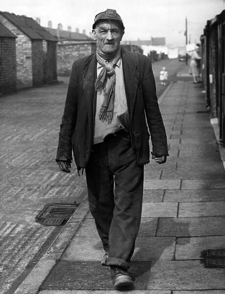 73-year-old Jack Lisle strides back to his home in Chesnut Street, Ashington