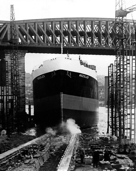 The 9, 200-ton ship Needles moves down the slipway at Austin