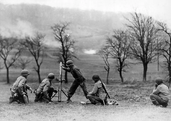 90th Infantry Division mortar crew fires high explosive (HE