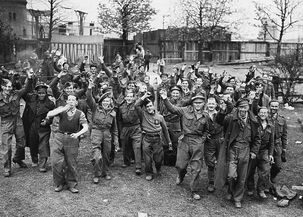 9th Army troops capture Oflag 79. Here British soldiers walk to freedom in Brunswick