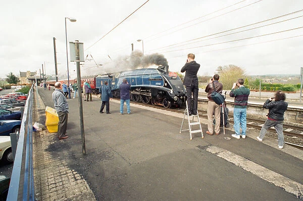 The A4 locomotive Sir Nigel Gresley powers its way through Morpeth Station as it