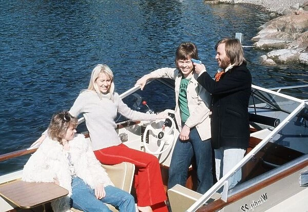 Abba pop group from Sweden relax on boat Circa 1976