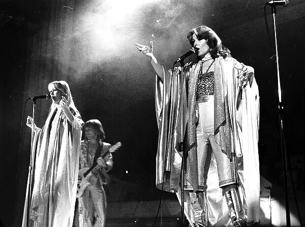 Abba singing on stage in February 1977