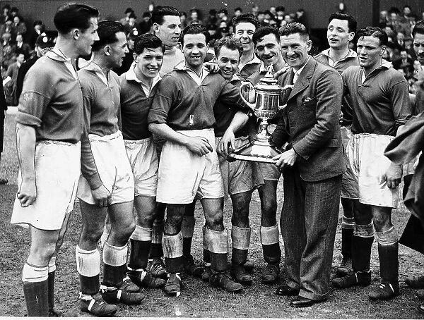 Aberdeen football players team manager celebrate after winning the 1947 Scottish FA Cup