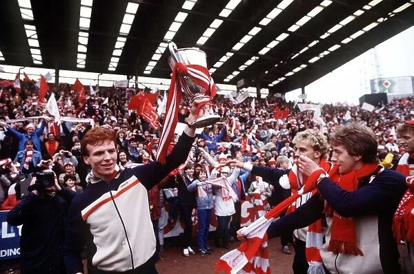 Aberdeens Alex McLeish holds the European Cup Winners Cup trophy for fans at