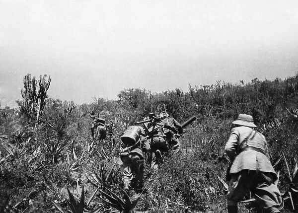 Abyssinian War October 1935 Italian infantry with machine guns follow in the wake