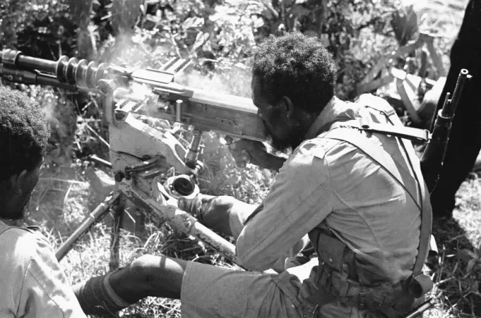 Framed Print : Abyssinian War September 1935 Abyssinian machine gunner firing an old Hotchkiss