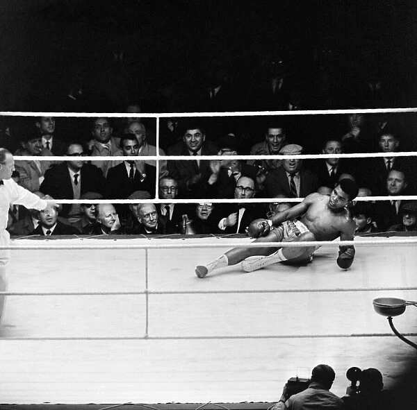 Action during the non-title heavyweight fight between American Cassius Clay