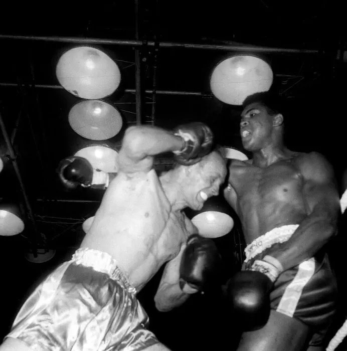 Framed Print : Action during the non-title heavyweight fight between American Cassius Clay