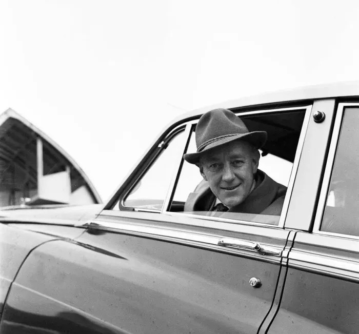 Framed Print : Actor Alec Guinness loading his Bently onto an aircraft bound for France where he will