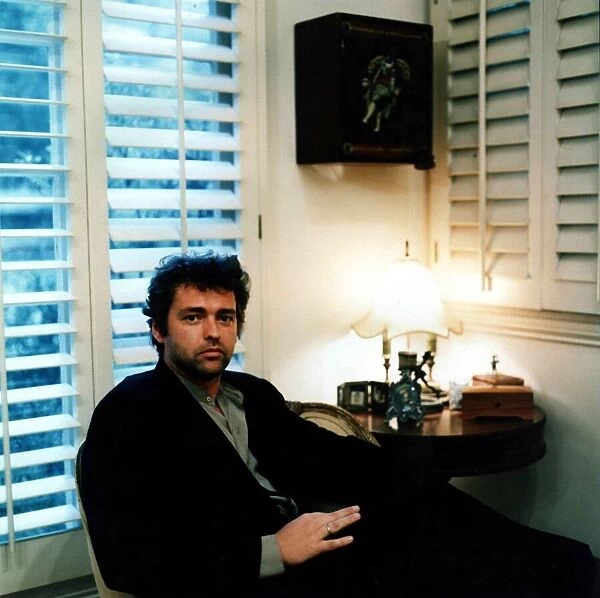 Actor Angus McFadden at home October 1998 sitting in chair