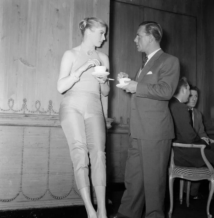 Framed Print : Actor and comedian Norman Wisdom enjoys a cup of tea with actress Anita Ekberg Framed Print : Actor and comedian Norman Wisdom enjoys a cup of tea with actress Anita Ekberg