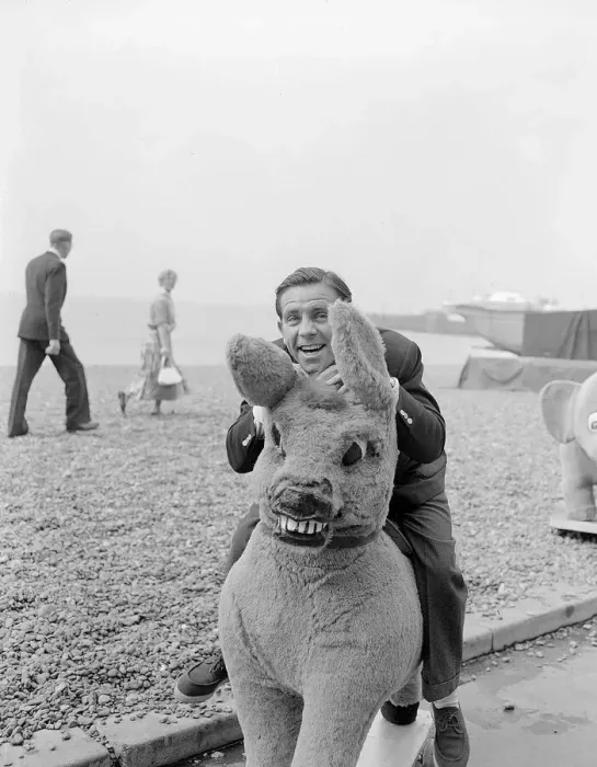 Framed Print : Actor and comedian Norman Wisdom photographed on Brighton Beach on a stuffed donkey Framed Print : Actor and comedian Norman Wisdom photographed on Brighton Beach on a stuffed donkey