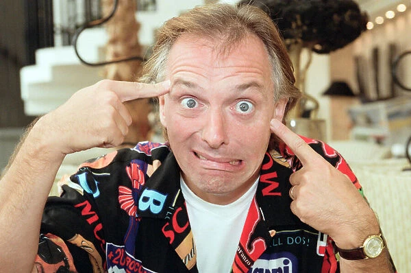 Actor and comedian, Rik Mayall, pictured at home four