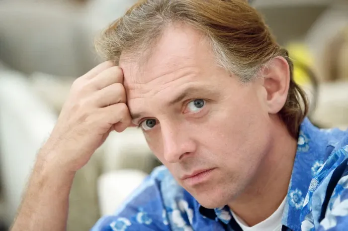 Framed Print : Actor and comedian, Rik Mayall, pictured at home four months after his horrific quad bike