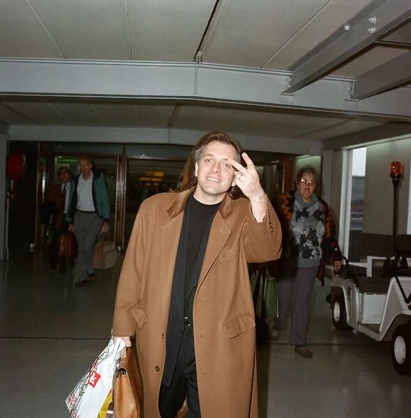 Actor and comedian, Rik Mayall, pictured at London Airport. 29th March 1992