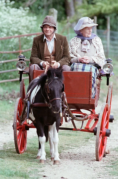 Actor David Jason filming 'Darling Buds of May', driving a horse and cart