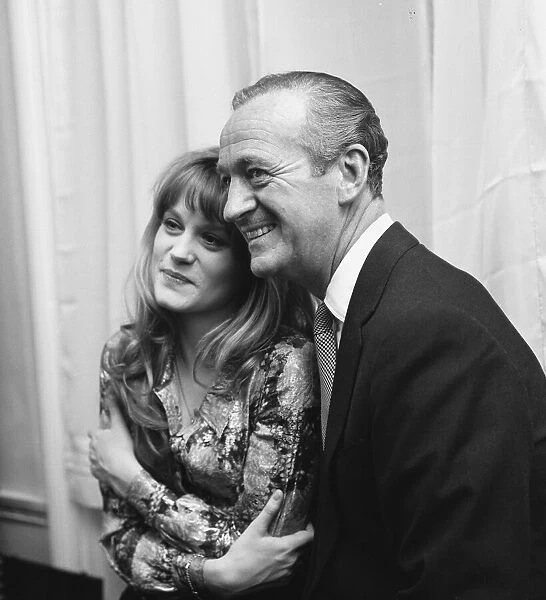 Actor David Niven with French actress Francoise Dorleac pose for photographers shortly