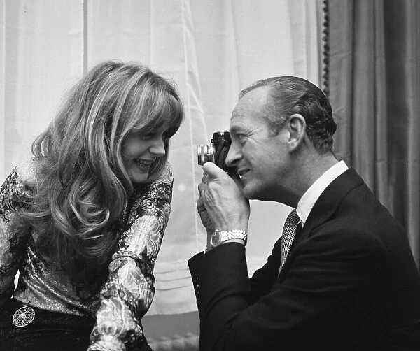 Actor David Niven photographs French actress Francoise Dorleac shortly before they leaft