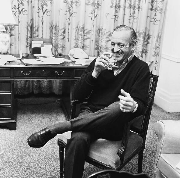 Actor David Niven relaxes in his London hotel suite. 3rd March 1965