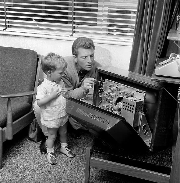 Actor Johnny Briggs at home with his son Mark. Circa 1963