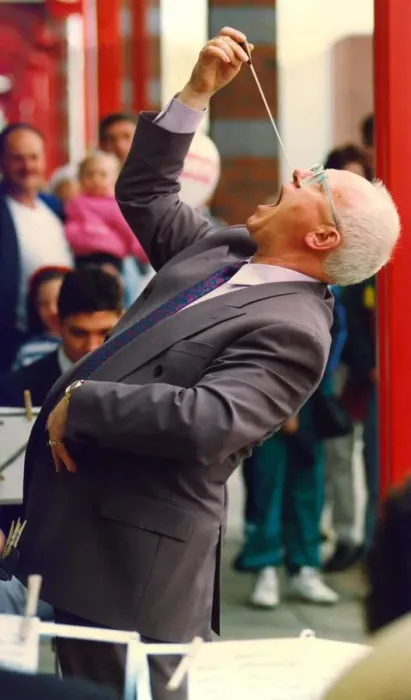 Framed Print : Actor Ken Morley hamming it up with the Eveready Brass Band when he opened by new MFI