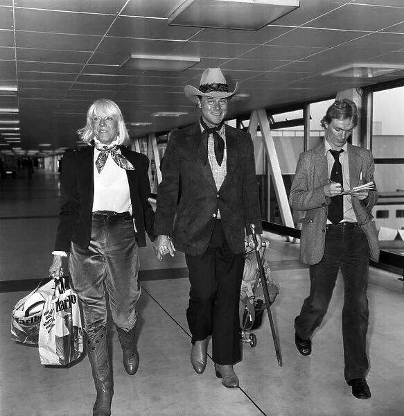 Actor Larry Hagman, Dallass J. R. Ewing, and his wife Maj arrive at London