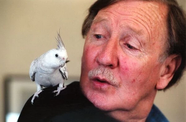 Actor Leslie Phillips with his co star Chazz the cockatiel, at the Theatre Royal