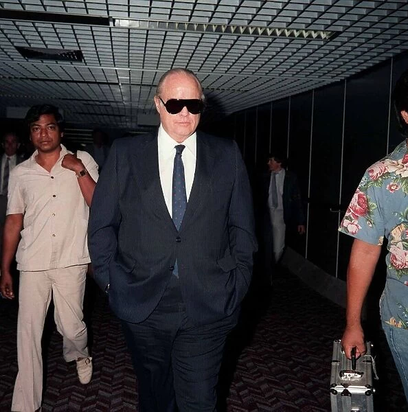 Actor Marlon Brando arriving at London Airport, June 1986