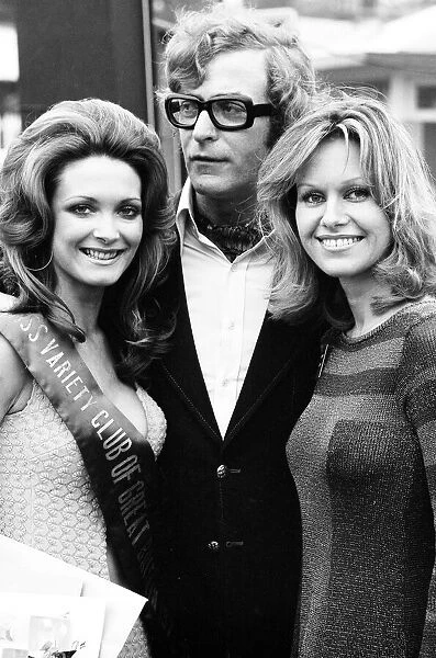 Actor Michael Caine and actress Suzanne Leigh photographed with competition winner